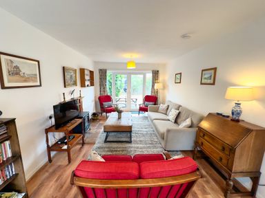 A living room with a sofa and armchairs at 38 Dale End Brancaster Staithe near Burnham Market