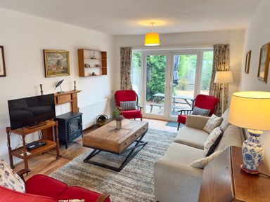 A living room with a coffee table and television at 38 Dale End Brancaster Staithe near Burnham Market