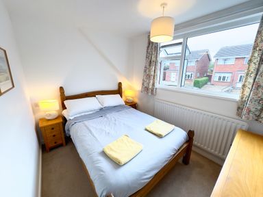 A bedroom with a bed and bedside table at 38 Dale End Brancaster Staithe near Burnham Market