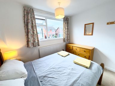 A bedroom with a bed and drawers at 38 Dale End Brancaster Staithe near Burnham Market