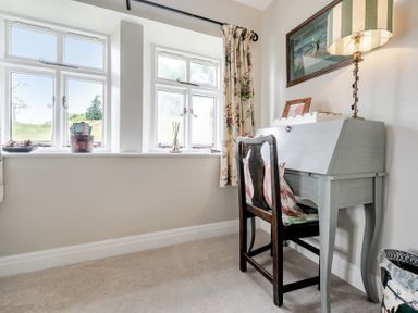 An office with a desk and chair at Dove Cottage at the Graythwaite Estate near Hawkshead