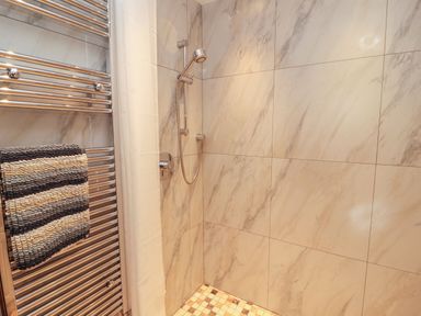 A shower in a bathroom at Sonya's Cottage Anthorn, Solway Firth