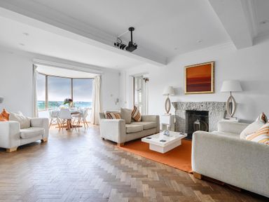 A living room with a sofa and coffee table at Cragford in Sennen Cove