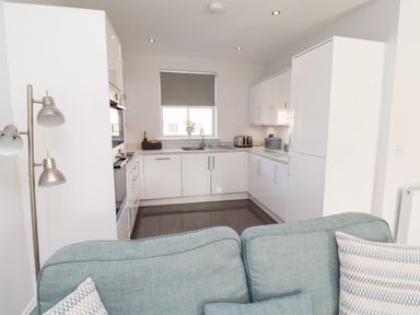 A kitchen with a sink and appliances at The Haven in Embleton