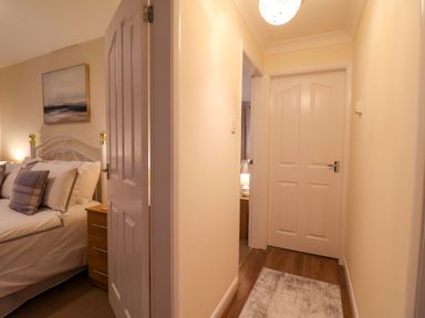 A bedroom with a bed and bedside table at La Rochelle in Whitby