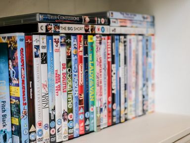 A collection of dvd movies arranged on a shelf at Stones Throw in Charlestown
