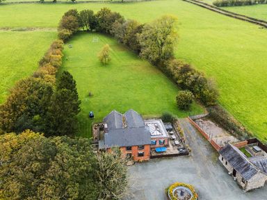 A house with a garden and fields at Bwthyn Ty Newydd in Llangadfan