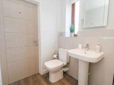A bathroom with a sink and toilet at Shepherd Oak Upwey near Weymouth