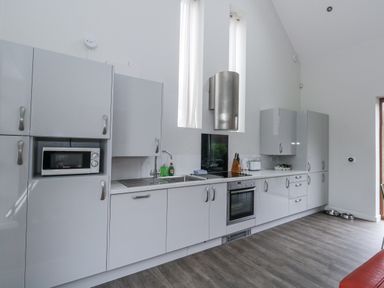 A kitchen with cabinets and appliances at Everdene Upwey near Weymouth