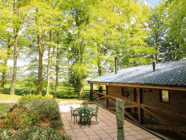 An outdoor seating area with table and chairs at Valley View Lodge Welshpool