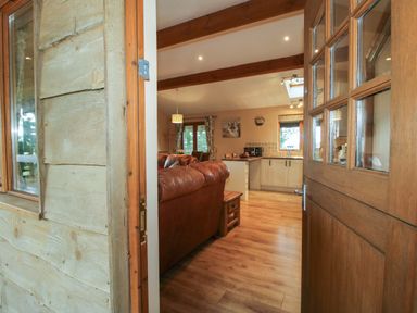 A view of a living room and kitchen area from the entrance at Valley View Lodge in Welshpool