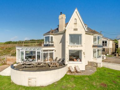 A house with a deck and yard at Carn Eve Sennen Cove near St Just