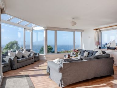 A living room with sofas and a coffee table at Carn Eve Sennen Cove near St Just