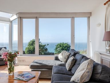 A living room with a view of the sea at Carn Eve in Sennen Cove near St Just