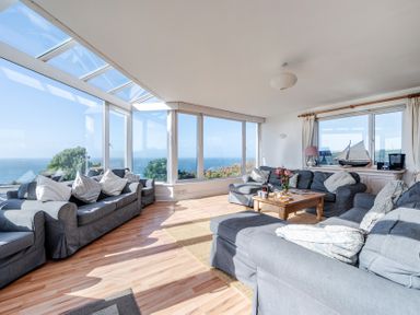 A living room with a view of the ocean at Carn Eve, Sennen Cove near St Just