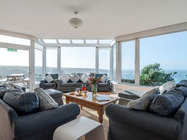 A living room with sofas and a coffee table at Carn Eve Sennen Cove near St Just