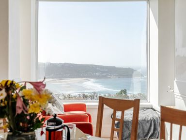 A dining room with a view of the coast at Carn Eve Sennen Cove near St Just