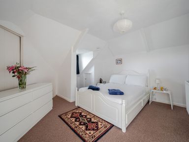 A bedroom with a bed and furniture at Carn Eve Sennen Cove near St Just