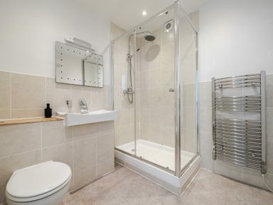 A bathroom with a shower and sink at Carn Eve in Sennen Cove near St Just