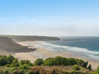 A beach view with waves at Carn Eve in Sennen Cove near St Just