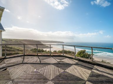 A deck with a view of the beach at Carn Eve in Sennen Cove near St Just