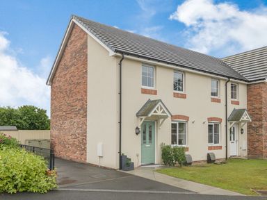 A two story semi detached house with a green door and driveway at Kymin View in Monmouth