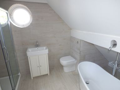 A bathroom with a shower enclosure sink toilet and bathtub at Pebworth Cottage Pebworth near Stratford-upon-Avon