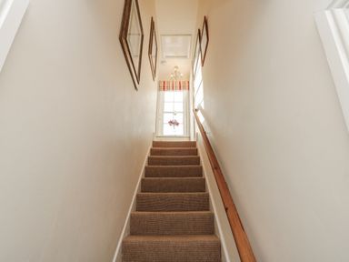 A staircase leading to a window at Croft View in Fylingthorpe near Robin Hood's Bay