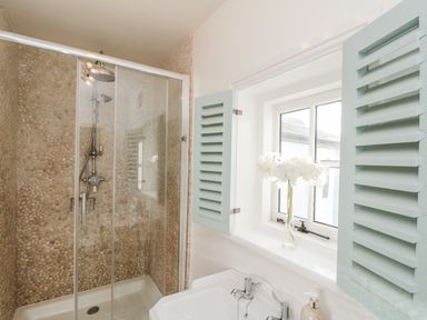 A bathroom with a shower and sink at Croft View in Fylingthorpe near Robin Hood's Bay