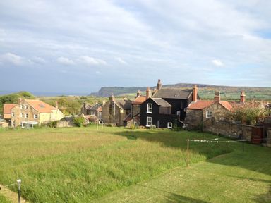 A view of houses and a field at Croft View in Fylingthorpe near Robin Hood's Bay