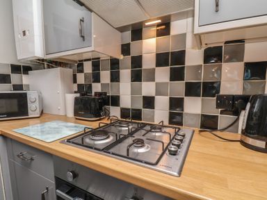 A kitchen with a gas hob and appliances at Fortunatus in Whitby
