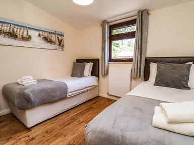 A bedroom with two beds at Snowdrop in Saltburn-by-the-Sea