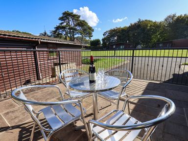 An outdoor area with a table and chairs at Snowdrop in Saltburn-by-the-Sea