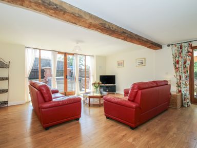 A living room with sofas and a coffee table at The Wainhouse in Bockleton near Tenbury Wells