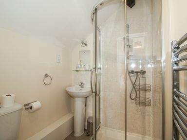 A bathroom with a shower and a washbasin at The Wainhouse in Bockleton near Tenbury Wells