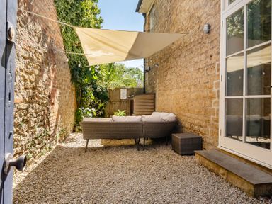 A garden area with outdoor furniture at East Wing in Crewkerne