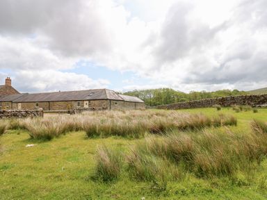 A stone building with grassland at Gallow Law Cottage Bellingham