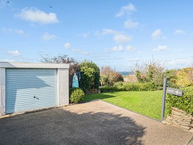 A garage and garden area at Sunset View in Porth