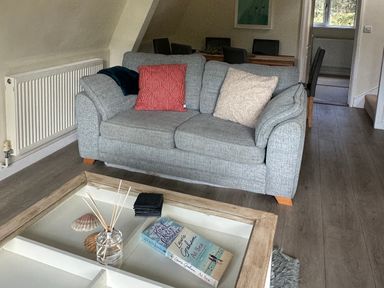 A living room with a sofa and a coffee table at Lodge 22, Bodmin Holiday Park, Cornwall Lanevet