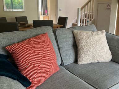 A sofa with cushions in a living room at Lodge 22, Bodmin Holiday Park, Cornwall