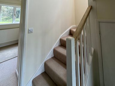 A staircase with handrail and window at Lodge 22, Bodmin Holiday Park, Cornwall
