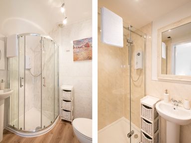 A bathroom with a corner shower enclosure a white wicker storage unit and a toilet at Spiral View in Perranporth