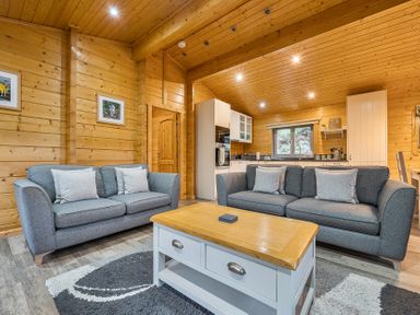 A living room with a sofa and coffee table at Elm Lodge in Ulverston
