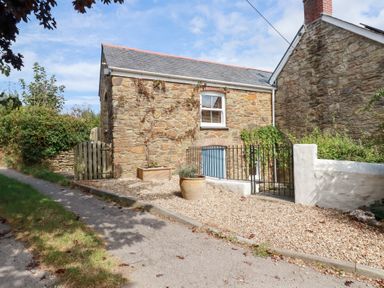 An outdoor view of a stone cottage at Mithian Cottage St Agnes