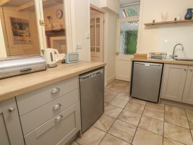 A kitchen with appliances on a countertop at Banneth in Helford