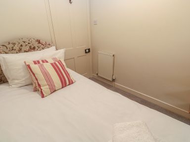 A bedroom with a bed and pillow at Banneth in Helford