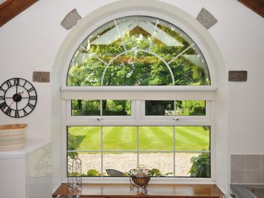 A window with a view of the garden at Trevenning Chapel Near Port Isaac