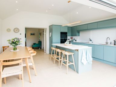 A kitchen with a dining area and modern fixtures at Lanesend in St Agnes