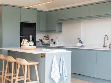 A kitchen with cabinets and appliances at Lanesend in St Agnes