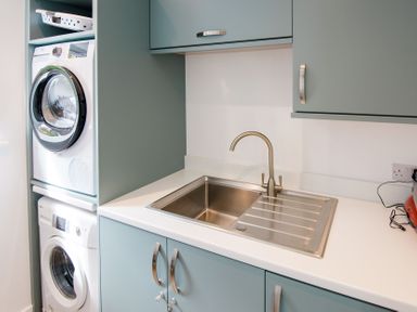 A laundry room with washing machine and dryer at Lanesend in St Agnes